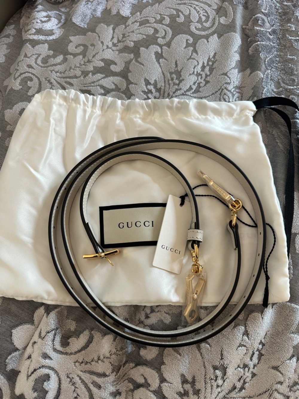 Gucci Black-Edged White Leather Strap with Gold Hardware